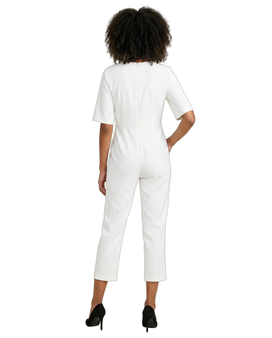 Person wearing a white jumpsuit on a white background