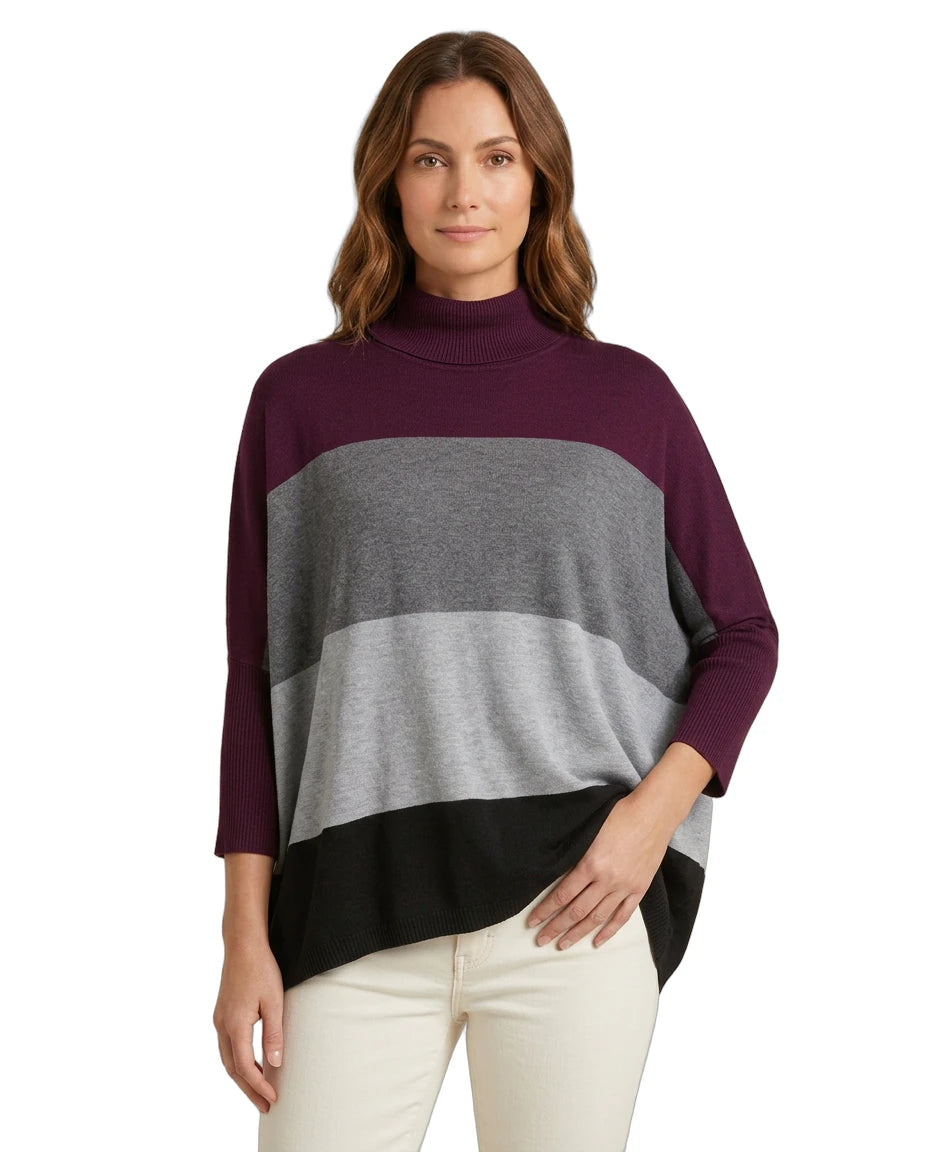 Woman wearing a color-blocked Calvin Klein sweater with a white background