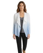 Woman wearing a light blue and white gradient cardigan on a white background