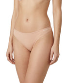 Beige Calvin Klein thong on a white background