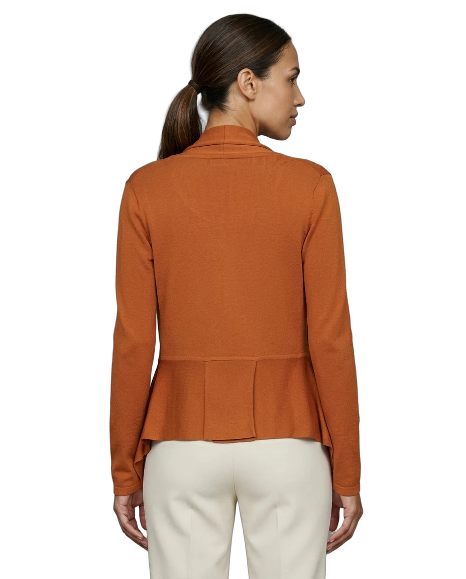 Woman wearing an orange peplum Calvin Klein cardigan on a white background