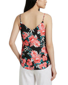 Woman wearing a floral tank top with a white background