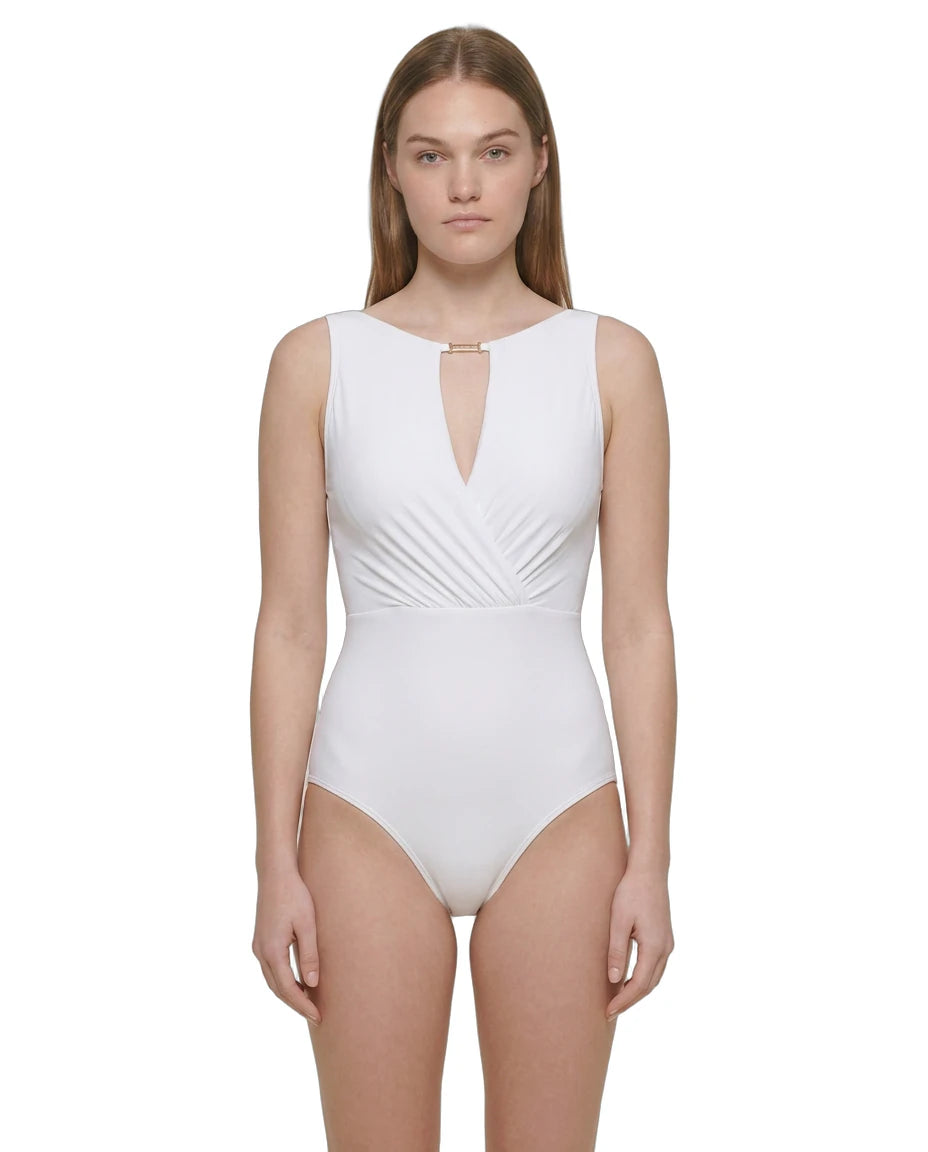 Woman wearing a white swimsuit on a white background