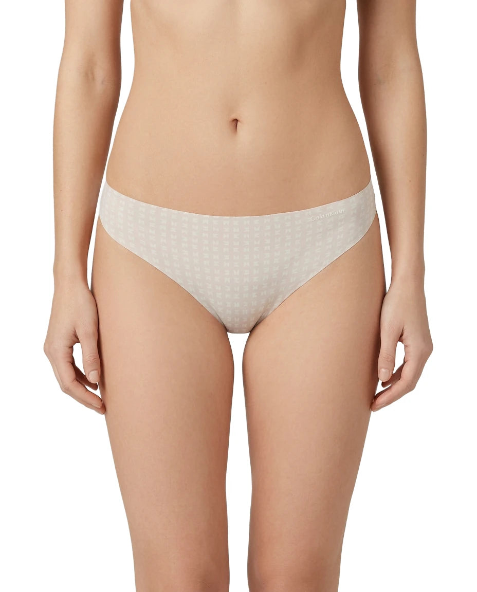 Beige patterned underwear worn by a person on a white background