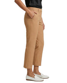 Tan Calvin Klein pants worn by a person on a white background