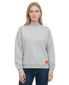Person wearing a Calvin Klein gray sweatshirt with a brand logo on a white background