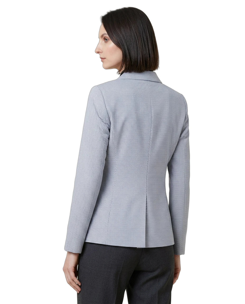 Woman wearing a gray blazer on a white background