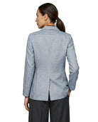 Person wearing a light blue Calvin Klein  checkered blazer on a white background