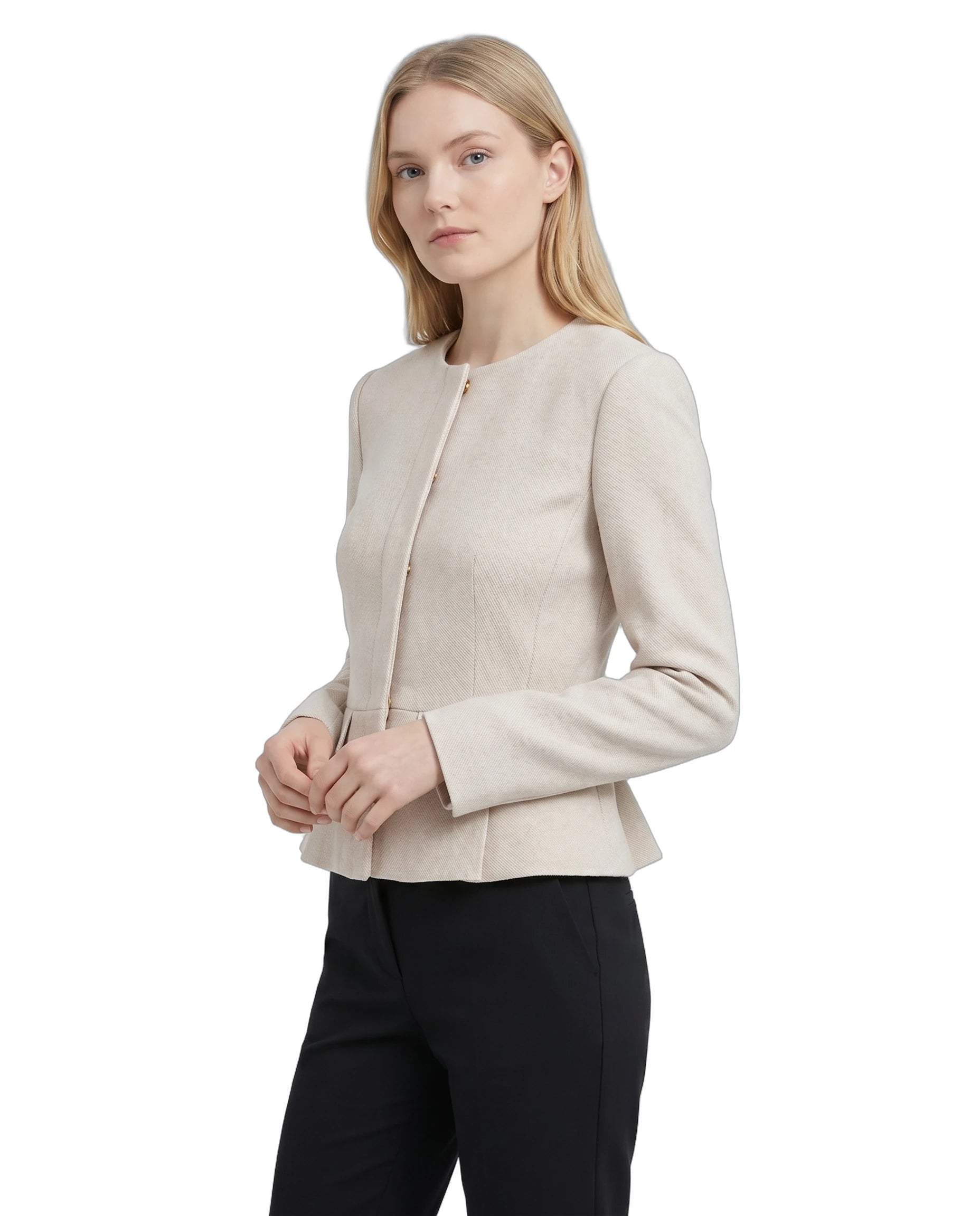 Woman wearing a Calvin Klein beige blazer and black pants on a white background