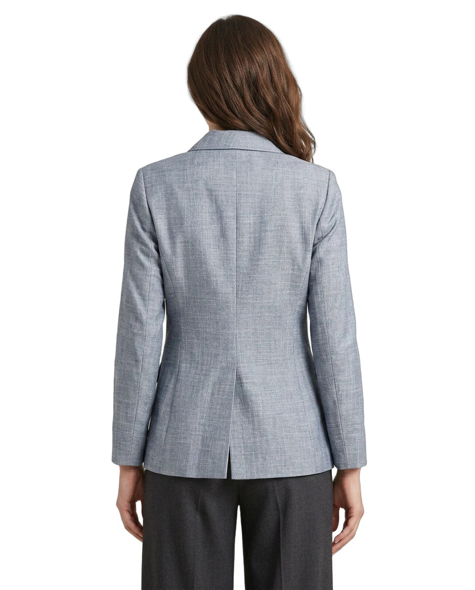 Person wearing a gray  Calvin Klein checkered blazer on a white background