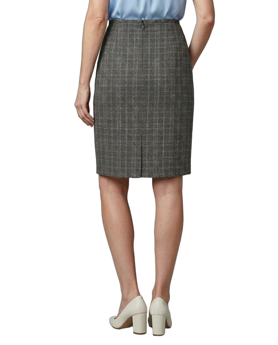 Person wearing a gray checkered skirt on a white background