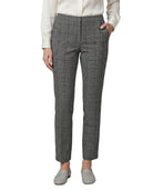 Person wearing gray Calvin Klein checkered pants on a white background