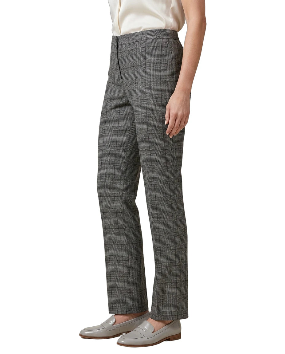 Person wearing gray Calvin Klein checkered pants on a white background