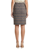Calvin Klein plaid skirt worn by a person on a white background