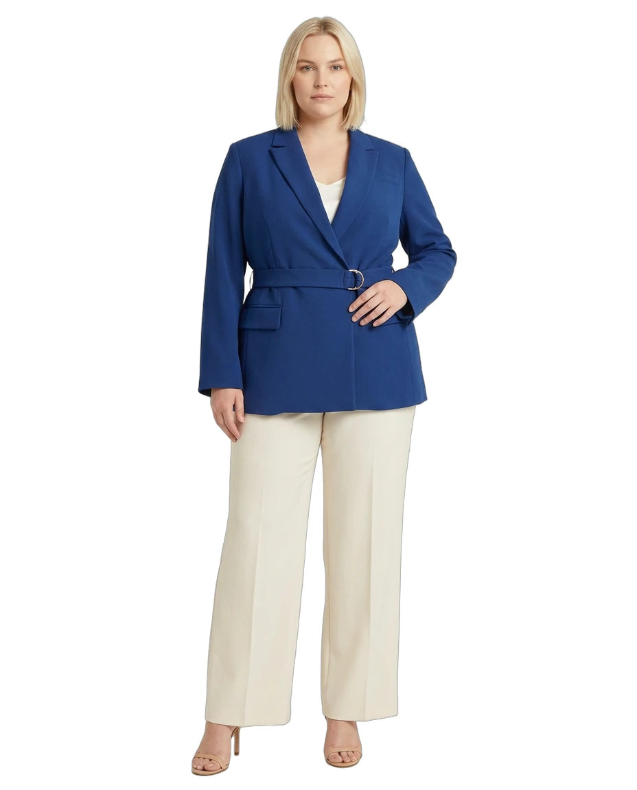 Woman wearing a Calvin Klein blue blazer and white pants on a white background