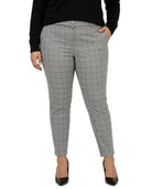 Calvin Klein gray checkered pants worn by a person on a white background