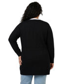 Person wearing a black Calvin Klein cardigan on a white background