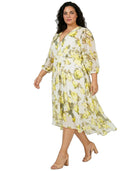 Woman wearing a Calvin Klein floral dress on a white background