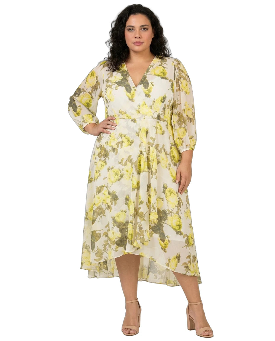 Woman wearing a Calvin Klein floral dress on a white background