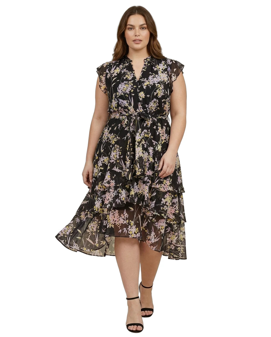 Woman wearing a Calvin Klein floral dress on a white background