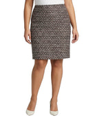 Person wearing a Calvin Klein patterned skirt on a white background