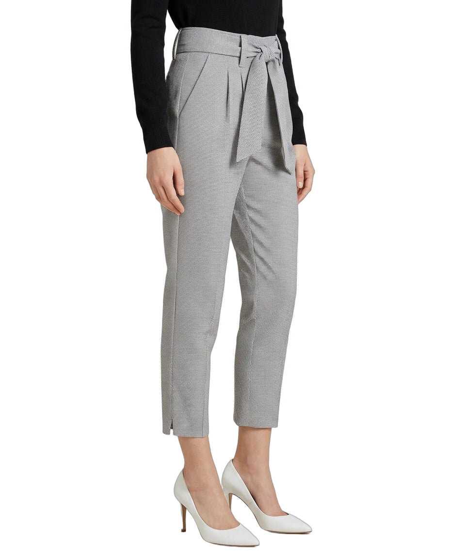 Gray Calin Klein pants with a tie waist worn by a person on a white background