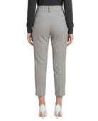 Light gray Calin Klein pants worn by a person on a white background