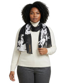 Woman wearing a Calvin Klein floral scarf with a visible brand logo on a white background