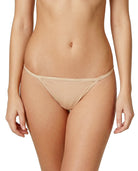 Beige Calvin Klein thong worn by a person on a white background