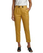 Mustard yellow Calvin Klein pants worn by a person on a white background