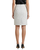 Person wearing a gray skirt on a white background