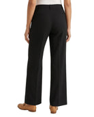Black Calvin Klein pants worn by a person on a white background