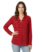 Woman wearing a red plaid Calvin Klein shirt with lace-up details on a white background