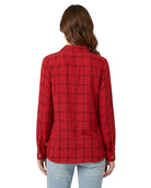 Person wearing a red plaid Calvin Klein shirt on a white background