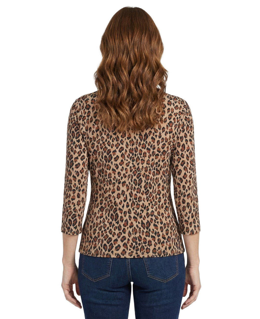 Woman wearing a leopard print top with a plain background
