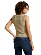 Back view of a woman wearing the INC International Concepts beige sleeveless knit sweater showing the back neckline, textured weave, and shoulder ruffles.