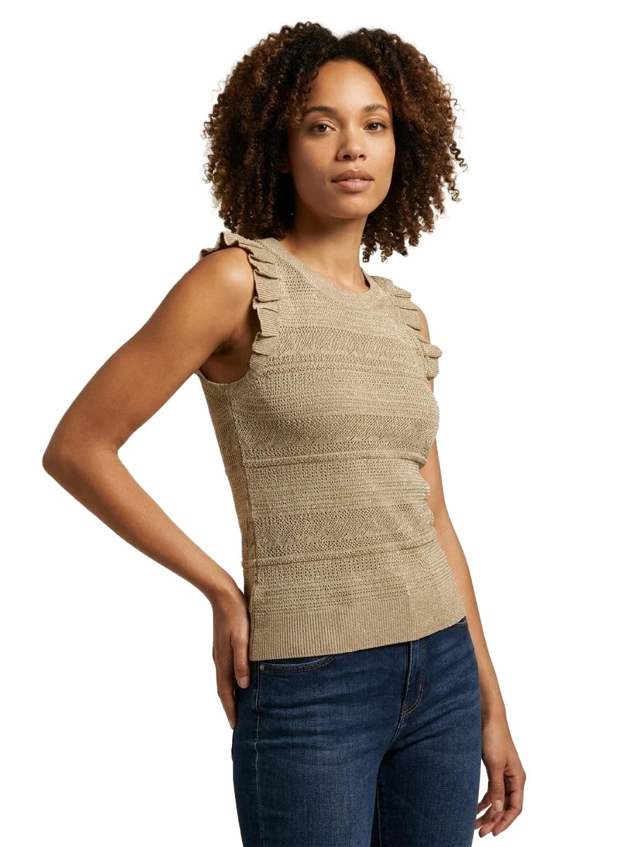 Slightly angled front view of a woman wearing the INC International Concepts neutral knit sleeveless top with ribbed crewneck and ruffle-accented shoulders.