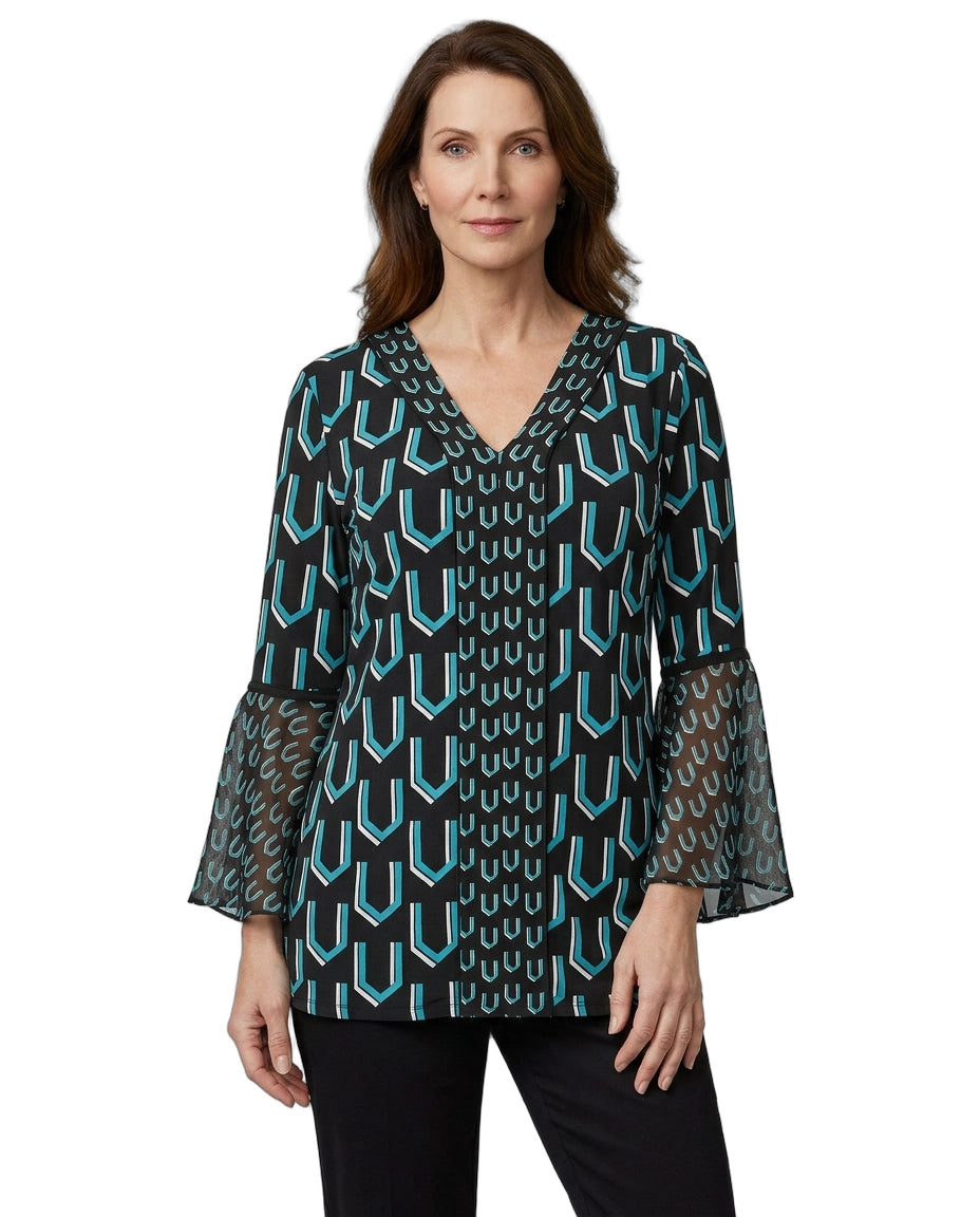Woman wearing a patterned blouse with bell sleeves on a white background