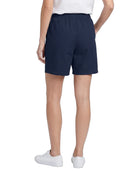 Person wearing navy shorts on a white background