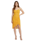 Woman wearing a yellow lace dress on a white background