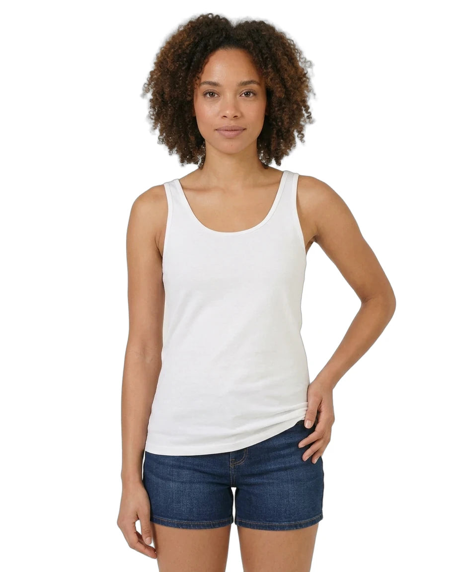 Woman wearing a white tank top and denim shorts on a white background