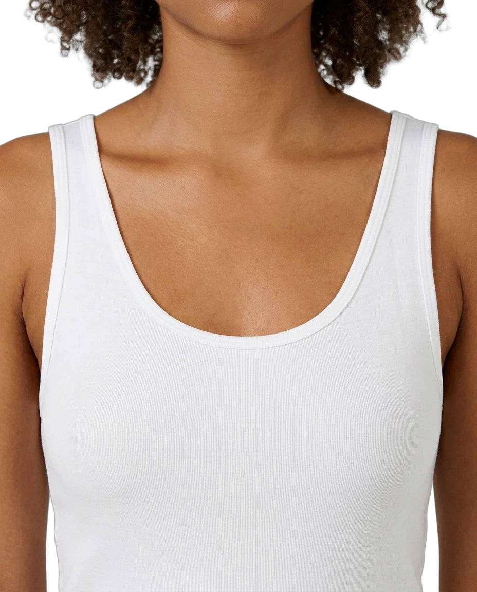 White tank top worn by a person on a white background