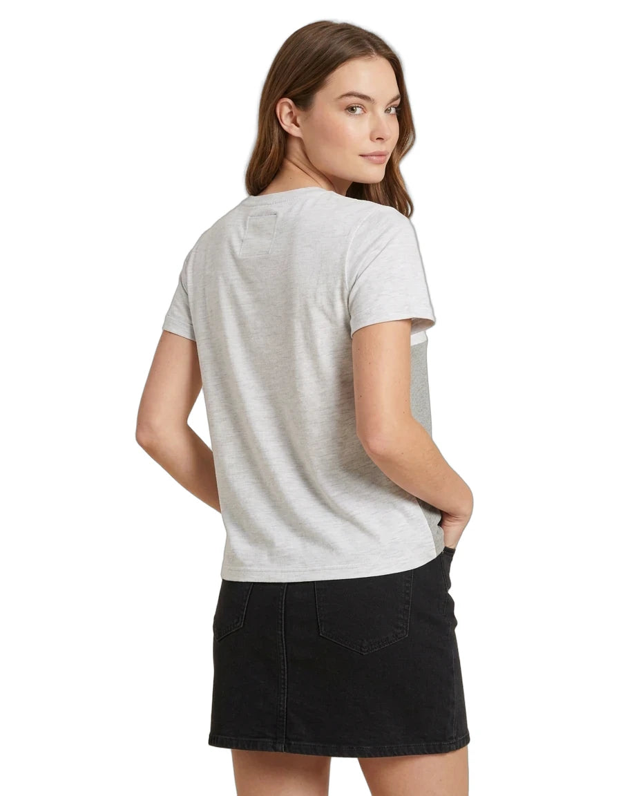 A woman shown from the back wearing a light gray short-sleeve t-shirt and a black denim mini skirt, photographed against a solid white background.