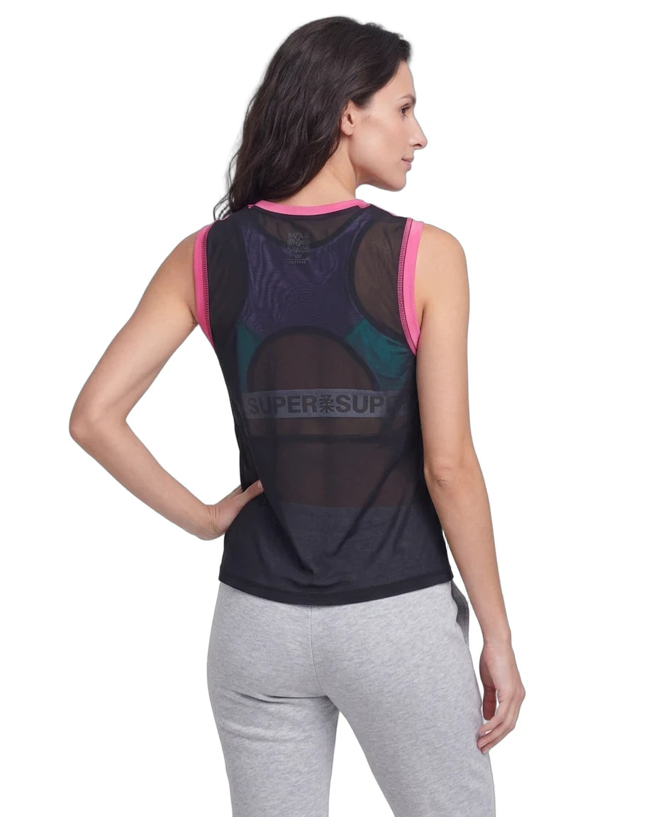 A woman shown from the back wearing a sleeveless athletic top with a sheer mesh back panel and a large SUPER'SUP logo across the center, paired with light gray sweatpants on a white studio background.